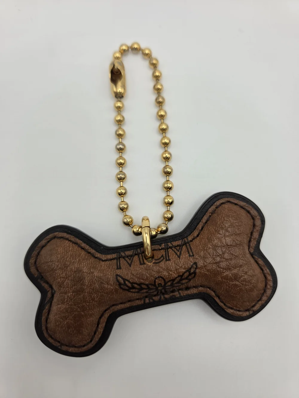 Authentic MCM Cognac Dog Bone Bag Charm